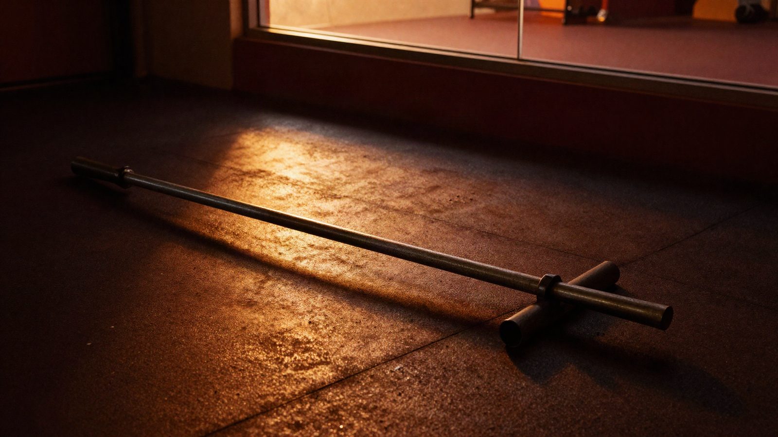 Low amber light across an empty dark floor